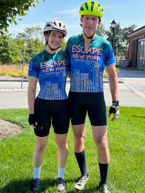 Two riders in ENY jerseys